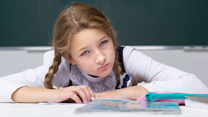 Naklejka premium Portrait of cute schoolgirl.Back to school, education concept.