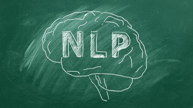 Chalk drawing of the human brain in the blackboard with lettering NLP inside.