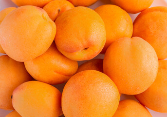 Fruit background from ripe bright apricots.