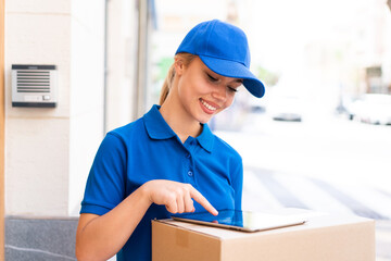 Young delivery woman at outdoors