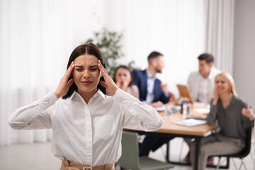 Coworkers bullying their colleague in office, space for text