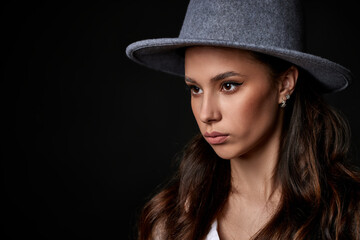 portrait of beautiful young woman in hat