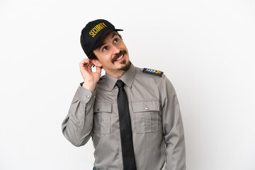 Young caucasian security man isolated on white background thinking an idea