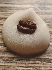 cappuccino foam with smiling coffee bean