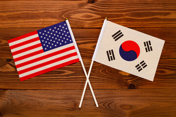 Flag of USA and flag of South Korea crossed with each other. USA vs South Korea. The image...