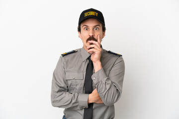 Young caucasian security man isolated on white background surprised and shocked while looking right