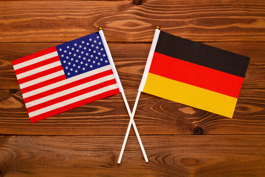 Flag of USA and flag of Germany crossed with each other. USA vs Germany. The image illustrates the relationship between countries. Photography for video news on TV and articles on the Internet 