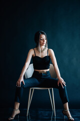 Beautiful young woman sitting on a chair