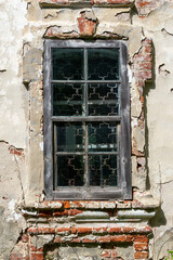 antique window in a brick wall