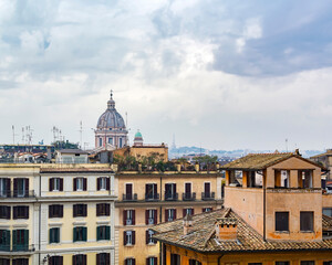 Obraz premium A view of the rome and the dome of the San Carlo al Corso basilica church as seen from the piazza della Trinita dei Monti, Rome, Italy
