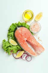 Concept of cooking salmon on white background