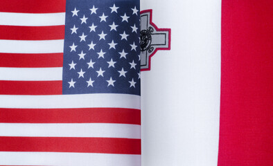 fragments of the national flags of the United States and Malta in close-up