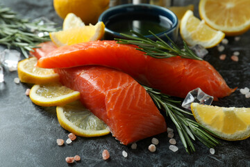 Concept of cooking salmon on black smokey background