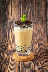 Fruity Bubble Tea in glass cup on wooden background