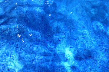 Bottom of a pool seen through the water