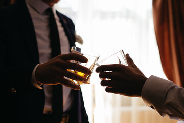 Young guys drink delicious whiskey