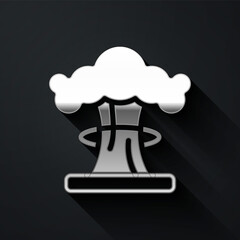 Silver Nuclear explosion icon isolated on black background. Atomic bomb. Symbol of nuclear war, end of world. Long shadow style. Vector