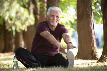 Naklejka na ściany i meble Senior man exercise in the morning living healthy