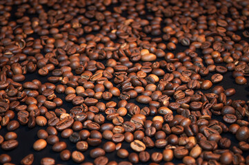 Roasted coffee beans on a black background