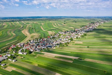 Village from drone. Suloszowa village in Krakow County, Lesser Poland Voivodeship, in southern Poland. Beautiful village with houses and fields in Poland.