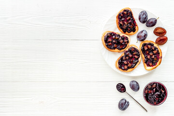 Sandwiches with plum jam, top view. Food layout