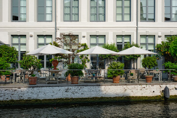 Cafe tables along canal in Bruges, Belgium