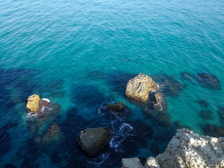 view of the rocks in a calm sea.