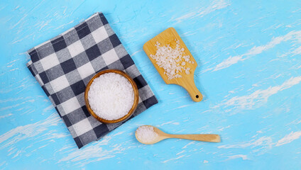 Strewing Sea salt crystals flat lay. Cooking and Healthcare concept.