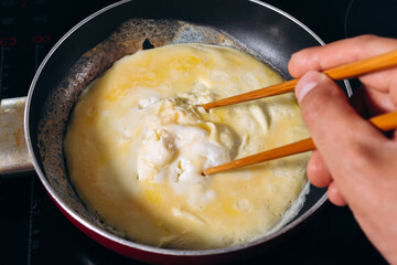 Cooking Tornado Omelette is a Korean dish. selective focus