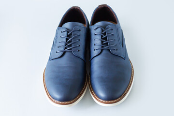Classic men leather casual blue shoes on gray background