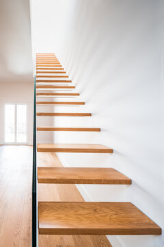 Stairs near white wall in modern house