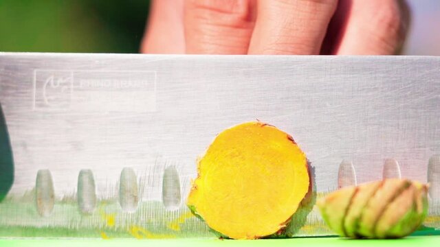 Close up Zingier cassumunar chopping knife slow motion