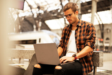 Man shopping online with laptop. Young man buying online with credit card