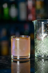 beige refreshing coctail on a bar desk