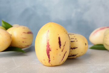 Fresh ripe pepino melons on light table
