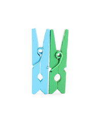 Two colorful wooden clothespins on white background