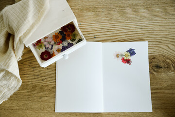 Beautiful notebook and dried flowers for journaling