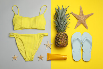 Flat lay composition with beach objects on color background