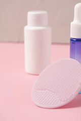 Facial cleansing brush and cosmetics, beauty treatment. Cosmetology and spa.