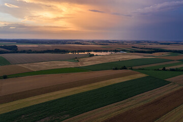 Obraz premium Storm in the countryside. Village from drone aerial view. Beautiful village with houses and fields in Nysa, Poland. Polish farmland