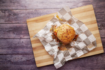  beef burger on a chopping on table top view 