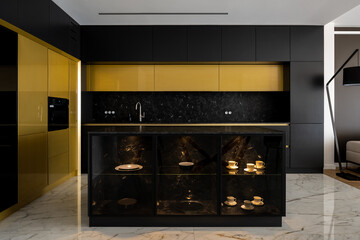 Exclusive gold and black kitchen with marble floor
