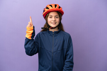 Little caucasian girl isolated on purple background pointing up a great idea