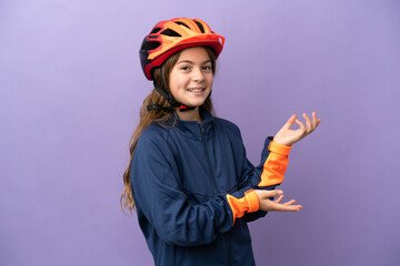 Little caucasian girl isolated on purple background extending hands to the side for inviting to come
