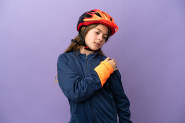 Little caucasian girl isolated on purple background suffering from pain in shoulder for having made an effort