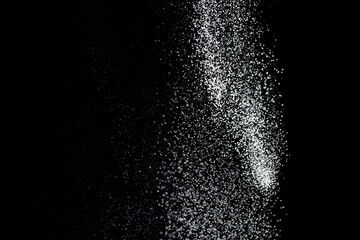 White powder explosion. White powder splash isolated on black background. Flour sifting on a dark background. Explosive powder white