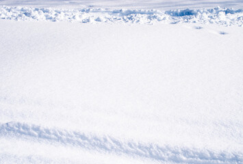 Tires have left lines imprinted in the white powdery snow that covered the ground in southwest Missouri.