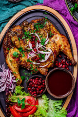 Chicken Tabaka.traditional Georgian dish .selective focus