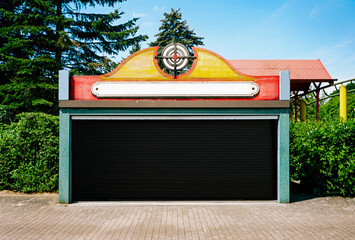 closed and locked shooting gallery on fairground.