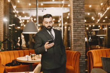 Stylish businessman in a black suit